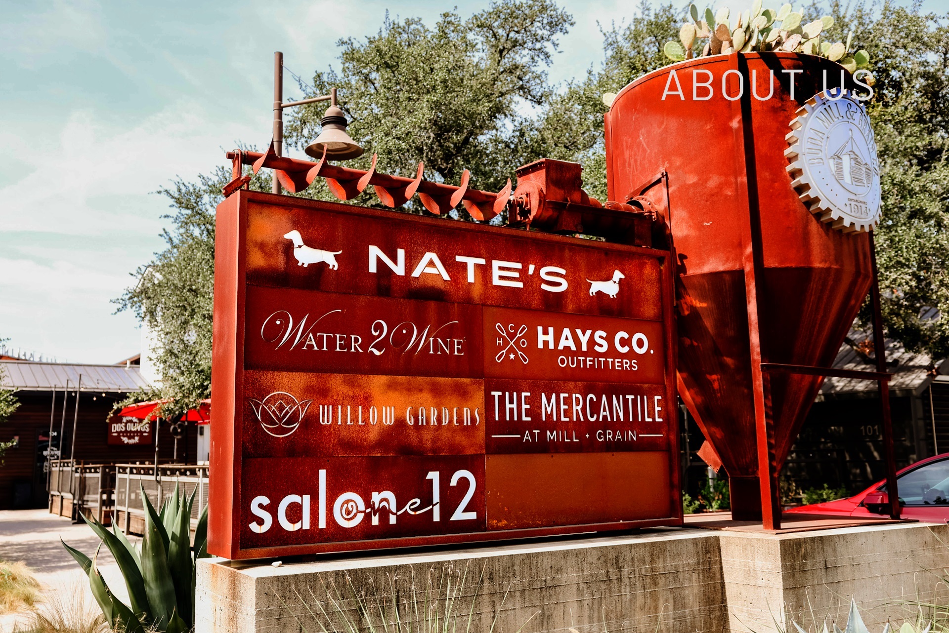 Buda Mill & Grain Co. Rustic sign with shop names